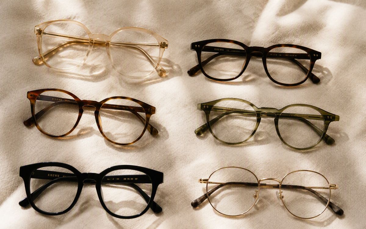 Six eyeglasses frames lined up for comparison